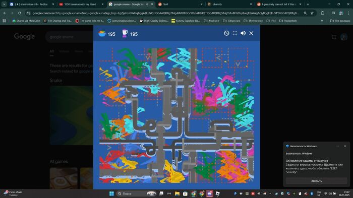 Google Snake game with colorful background showing pipes and scores, demonstrating hidden Google Easter eggs and tricks.