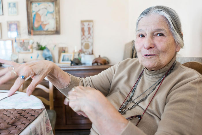 Elderly woman explaining family conflict over beloved heirloom ring amid proposals and accusations of selfishness.
