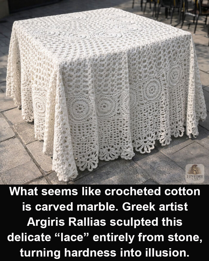 Carved marble sculpture mimicking crocheted lace, a historical marvel showcasing stone artistry and illusion of delicate fabric.