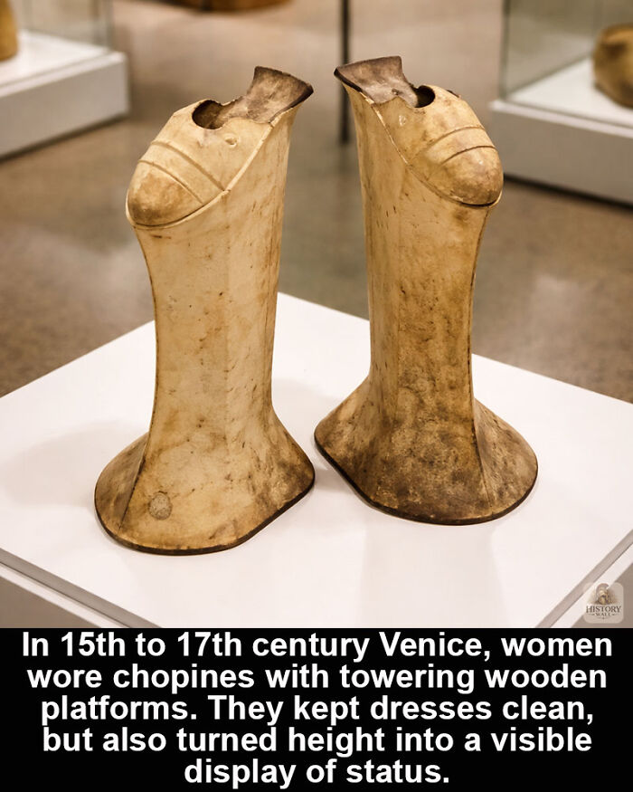 Pair of historical wooden chopine shoes from 15th to 17th century Venice, showcasing historical marvels of fashion and status.