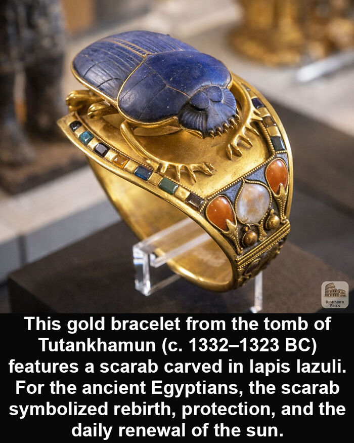 Gold bracelet with lapis lazuli scarab from ancient Egypt, a historical marvel symbolizing rebirth and protection.