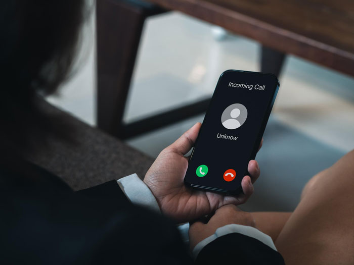 Man holding phone showing incoming call, symbolizing man&rsquo;s outburst about mustard not being the real issue