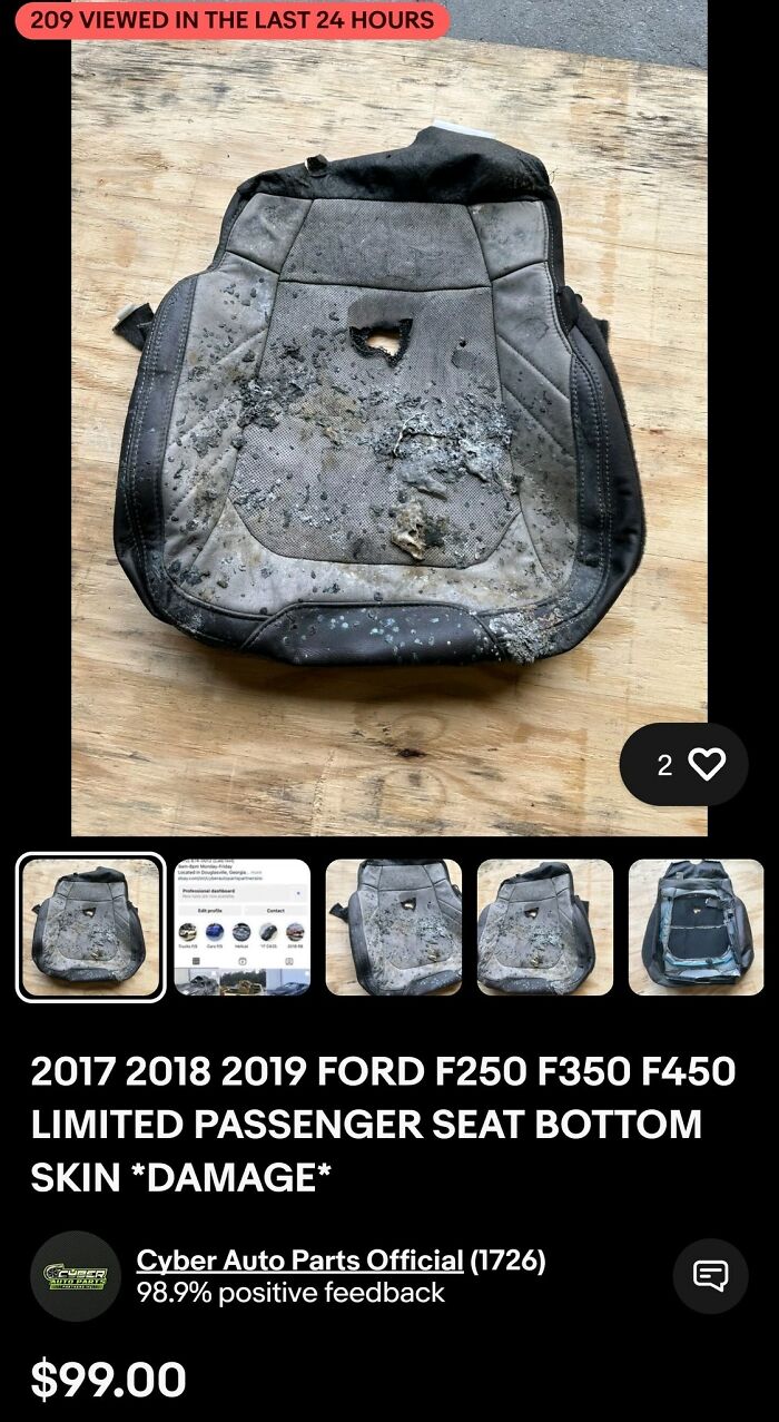 A damaged Ford F-series passenger seat, burnt and tattered, on a wooden surface. An example of selling trash.
