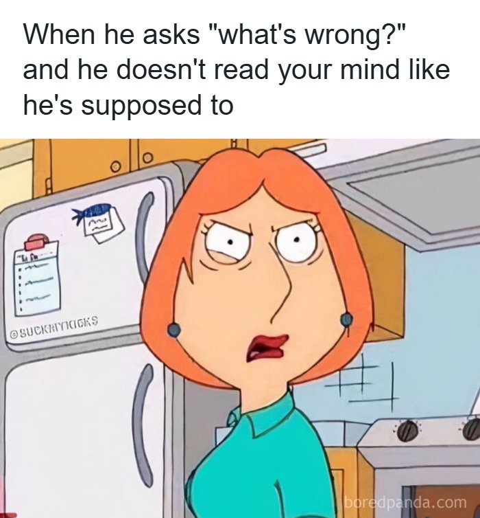 Woman with red hair looking annoyed in kitchen, illustrating romantic relationships and communication struggles meme.