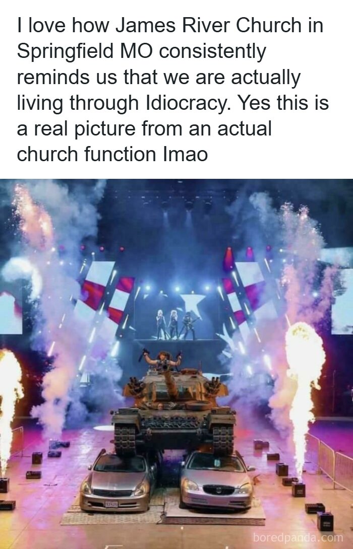 Church event with tank crushing cars, fireworks, and performers on stage, illustrating depressing moments of idiocracy.