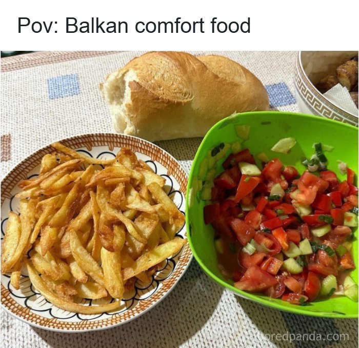 Balkan comfort food with fries, fresh vegetable salad, and a piece of bread on a tablecloth background meme.