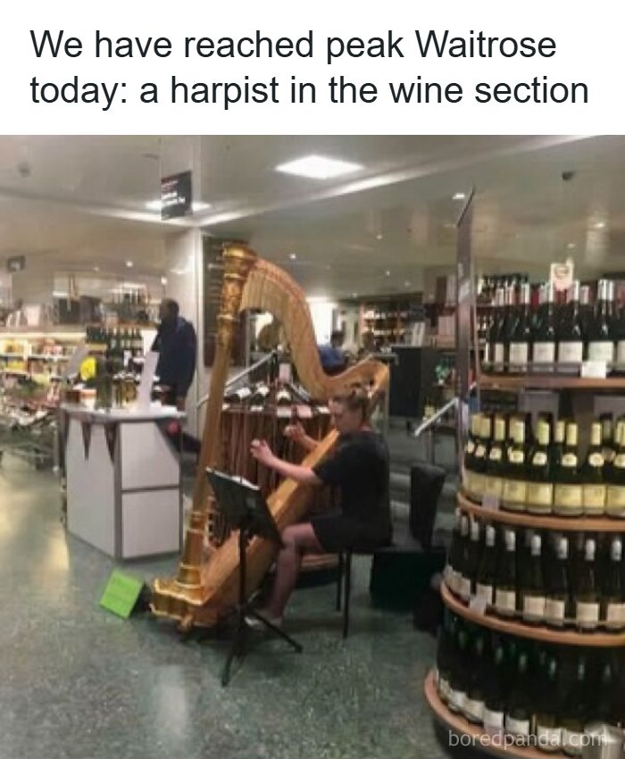 A harpist playing in a Waitrose wine section, a British meme the whole world can laugh at.