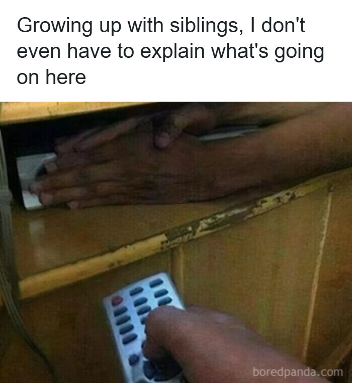 Hand hiding remote control under table with caption about growing up with siblings from 90s memes nostalgia.
