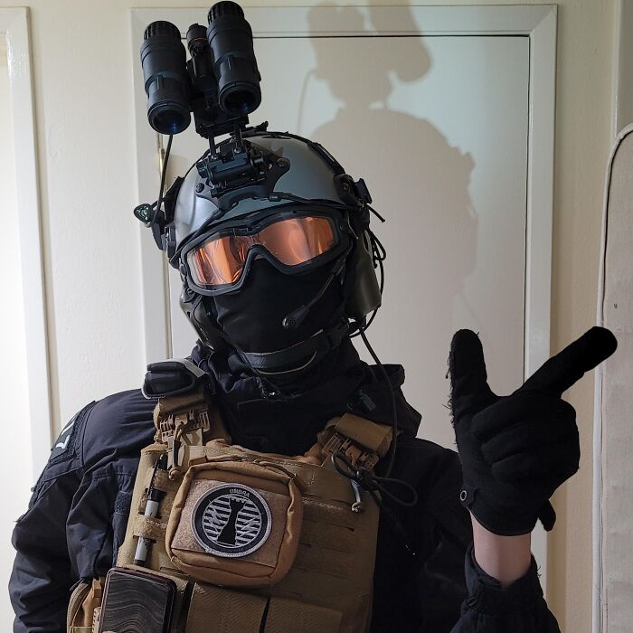 Person in tactical gear and helmet posing indoors, illustrating a contrast to trashy tacky distasteful wedding stories.