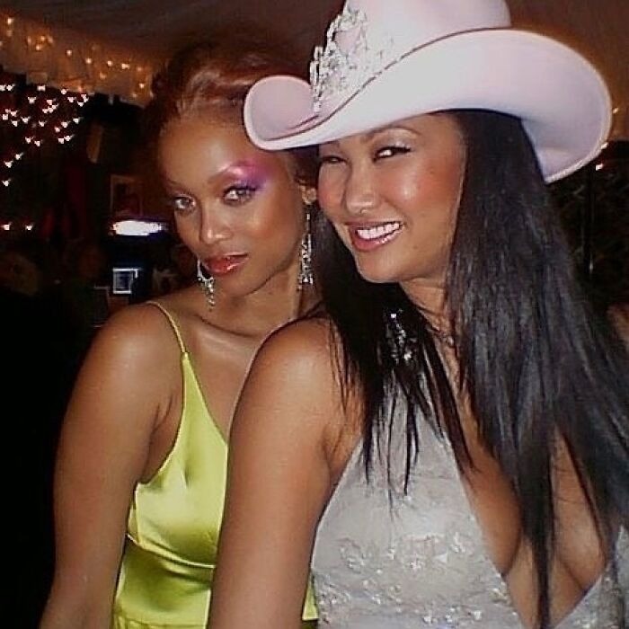 Two women dressed glamorously at an event showing celebrity friendships