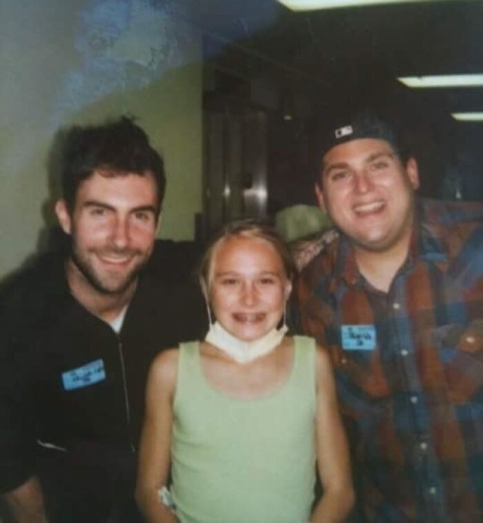 Three friends smiling in casual photo indicating celebrity friendships