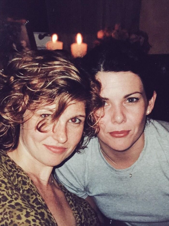 Two women close up with candles in background showing celebrity friendships
