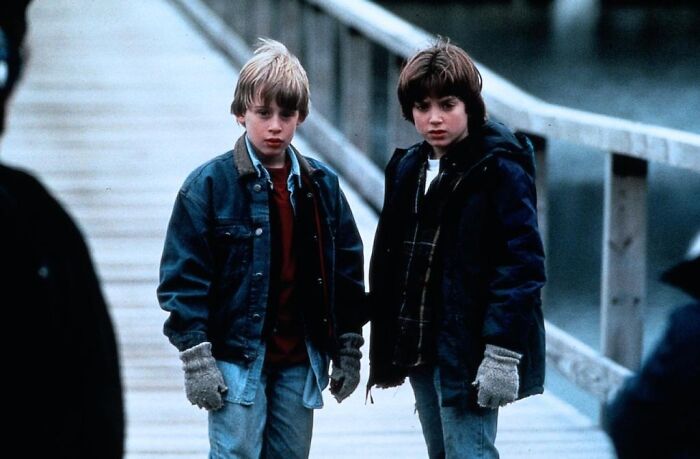 Two young boys standing on a dock showing childhood friendship of celebrities