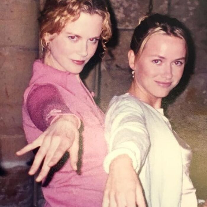 Two women posing playfully inside showing celebrity friendships