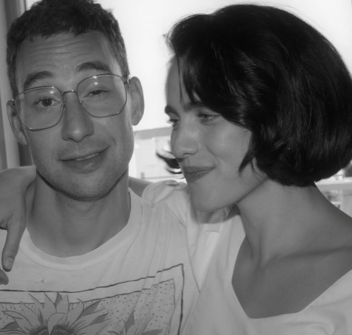 Couple in a candid moment, illustrating themes related to peak main character syndrome and relationship challenges.