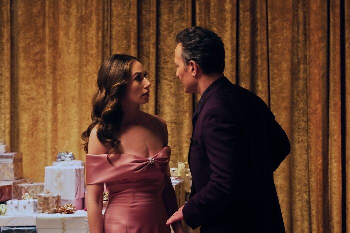 Sydney Sweeney on Euphoria, wearing a pink dress, in a dramatic scene with another actor.