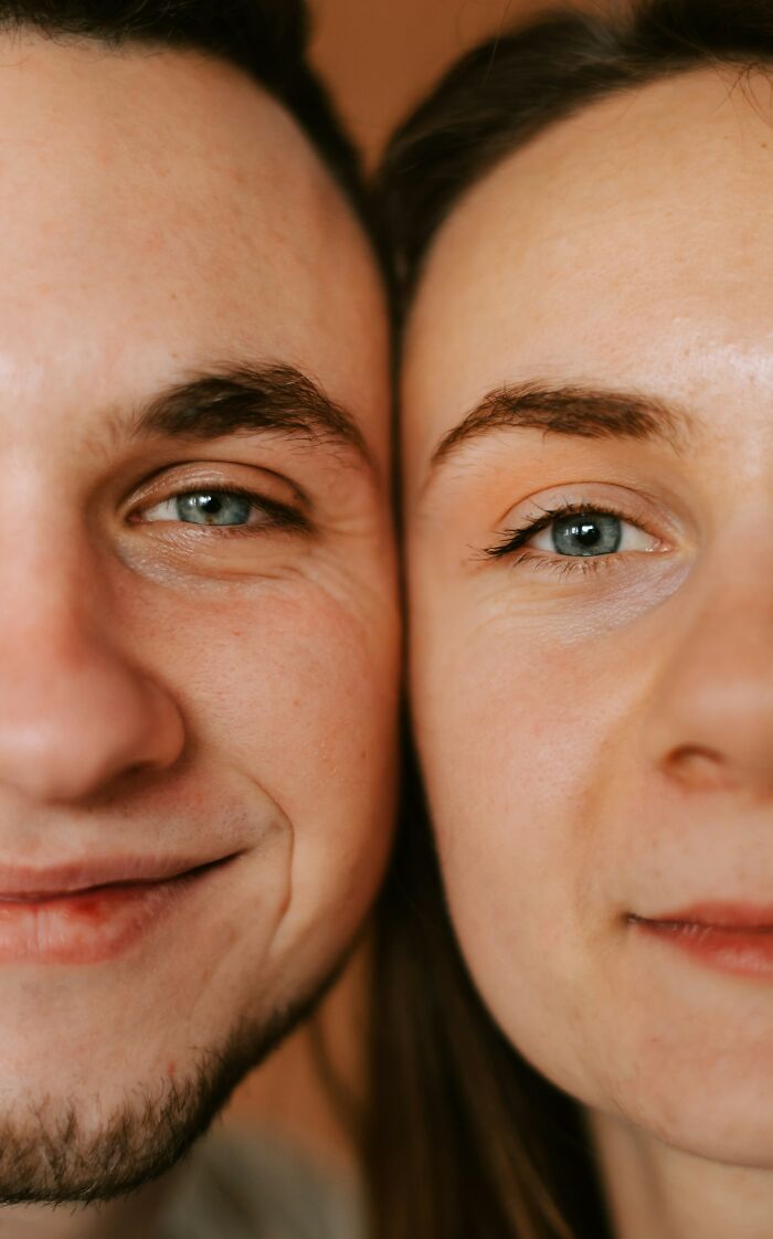 Close-up of two faces side by side showing natural skin details for weird and interesting medical facts about human health.