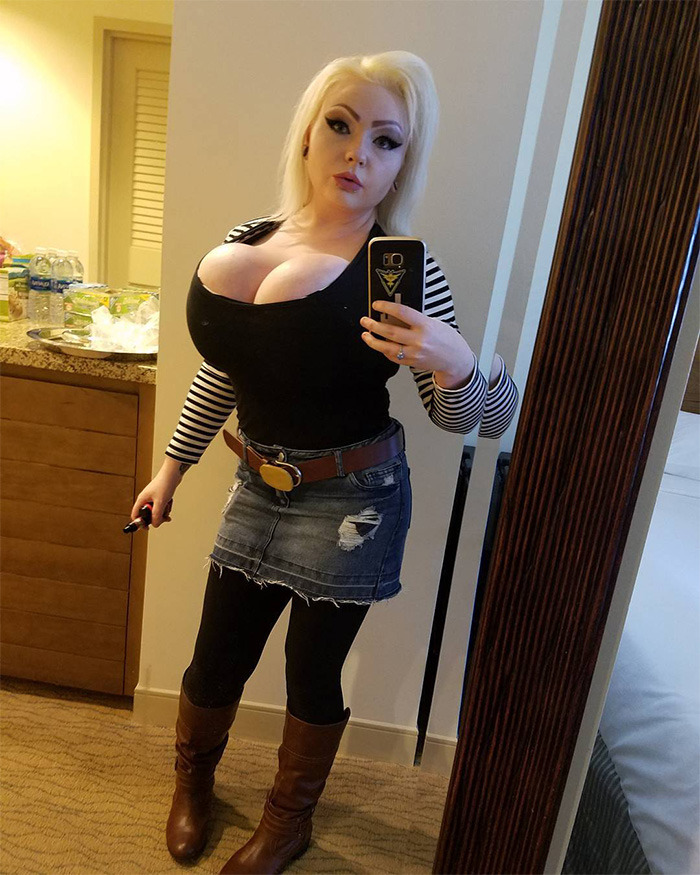 Woman taking mirror selfie in striped top and denim skirt, illustrating Kristi And Bryon Noem’s $2.6 million debt scandal luxury spending.