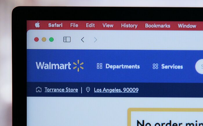 Close-up of a laptop screen showing Walmart website, illustrating random life decisions leading people to the right place.