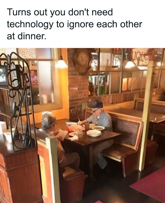 Two older people sitting and ignoring each other at a restaurant table, a funny safe-for-work meme about ignoring.