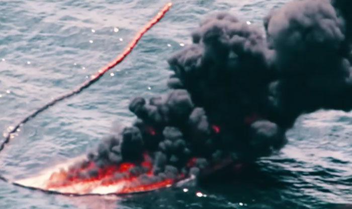 Burning oil rig fire on water with thick black smoke representing historical mistakes with massive consequences.