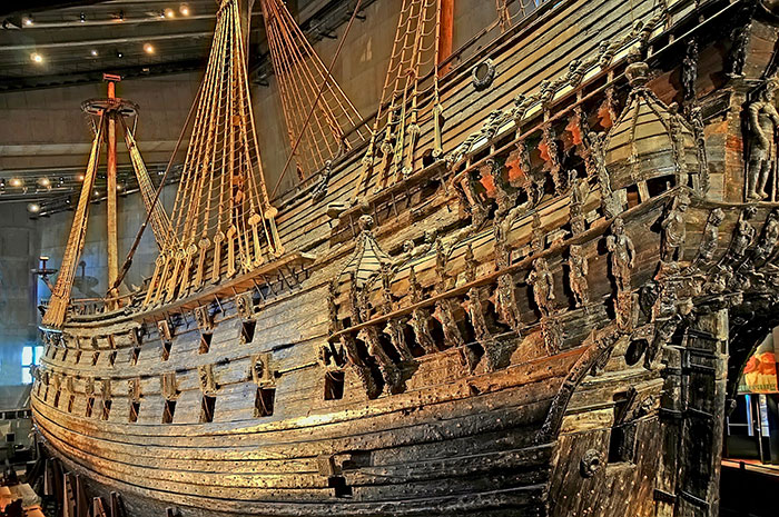 Large old wooden ship displayed in a museum representing historical mistakes with massive consequences in naval history.