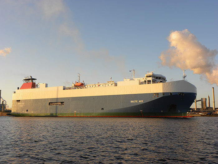Large cargo ship docked at a harbor during sunset illustrating historical mistakes with expensive maritime consequences.