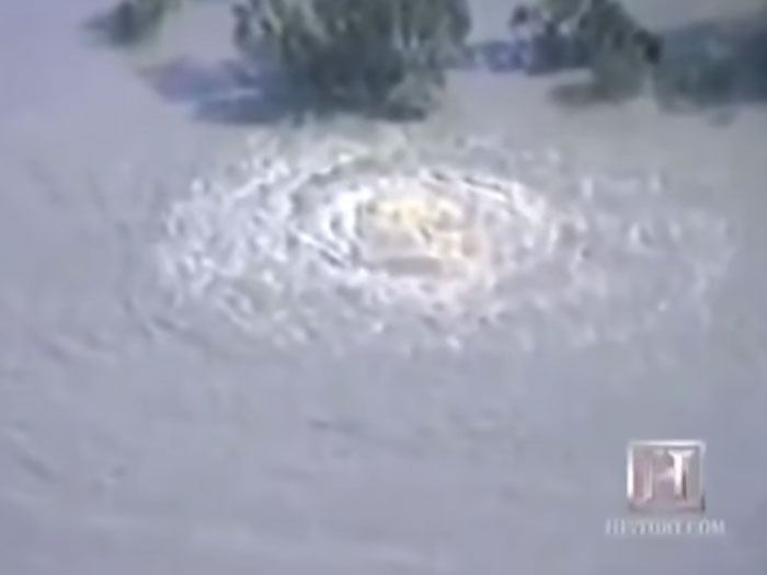 Underwater whirlpool in a historical mistakes event showing massive water disruption with expensive consequences visible from above.