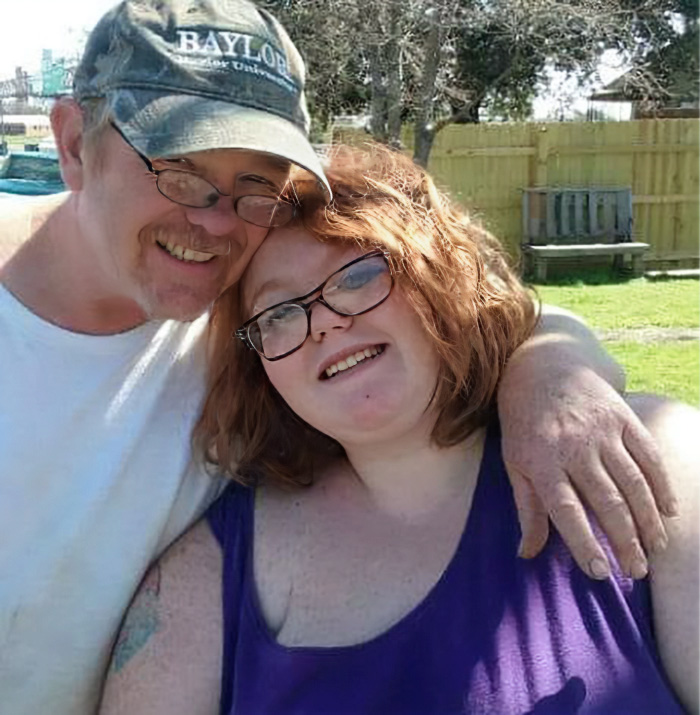&lsquo;My 600-Lb. Life&rsquo; star Dolly Martinez smiling outdoors with a man wearing a Baylor cap in a sunny backyard setting