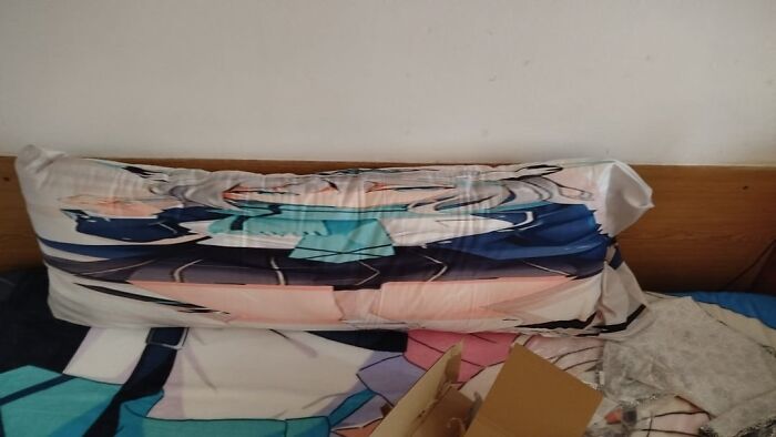 A severely distorted anime body pillow, illustrating a common lesson learnt from Temu or AliExpress orders.