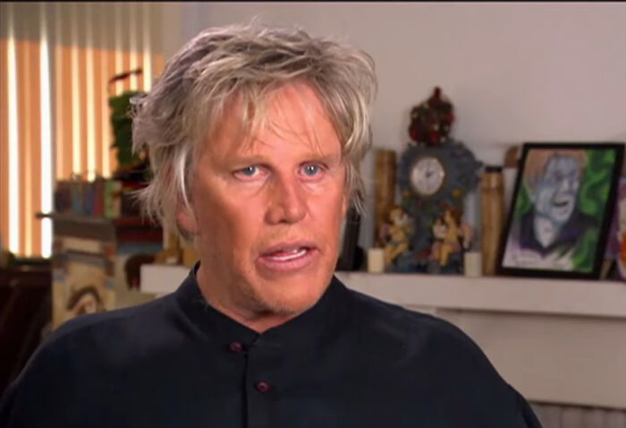 A man with messy blond hair and blue eyes, wearing a black shirt, speaks. Could be one of the rudest celebs.