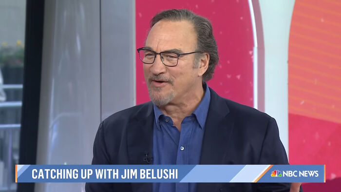 Jim Belushi, a famous celeb, smiling during an interview on NBC News about meeting or working with other celebrities.