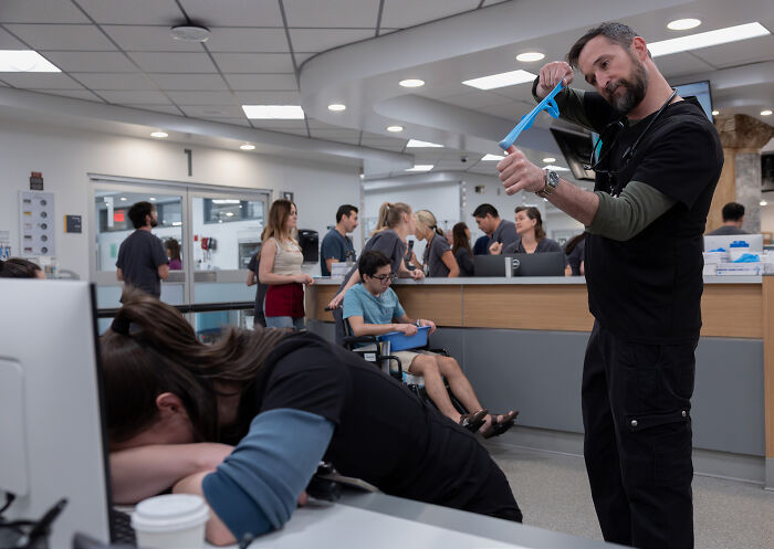 Hospital staff attending to patients in a busy emergency room scene from The Pitt Season 3.
