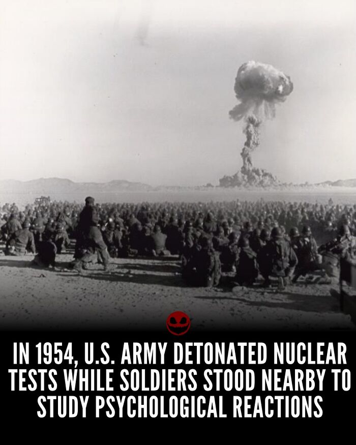 Black and white photo of soldiers watching a nuclear explosion test, illustrating weird and odd facts for the brain to think about.