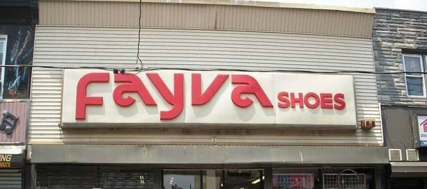 A red Fayva Shoes sign on a white storefront, an old photo that makes people take a trip down memory lane.