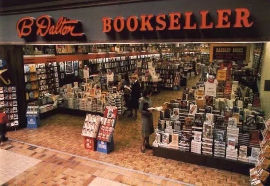 An overhead view of a bustling B Dalton Bookseller store, packed with customers and books. Take a trip down memory lane!