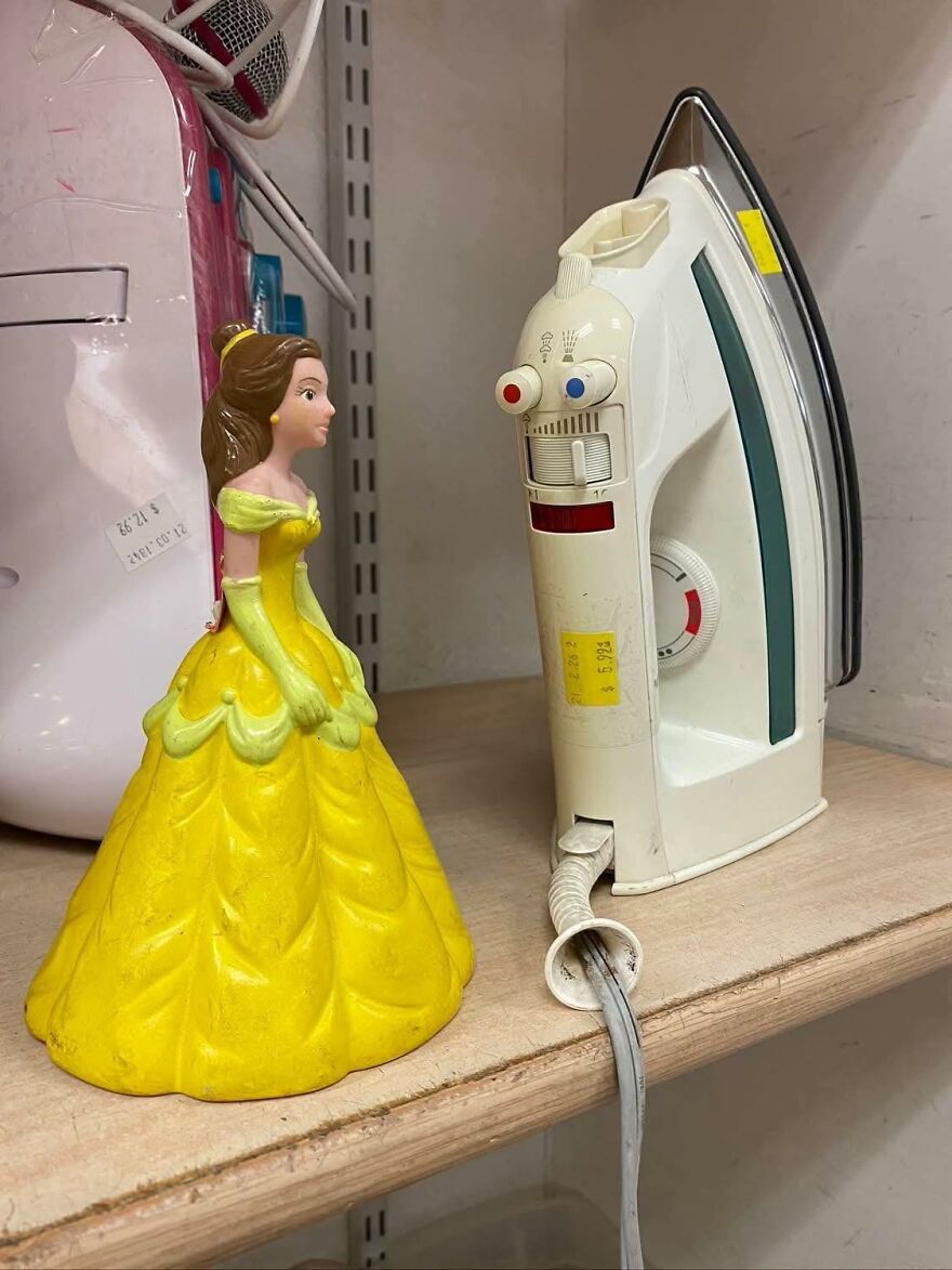 Toy princess figurine facing an iron with pareidolia effect making the iron look like a face with eyes and mouth.