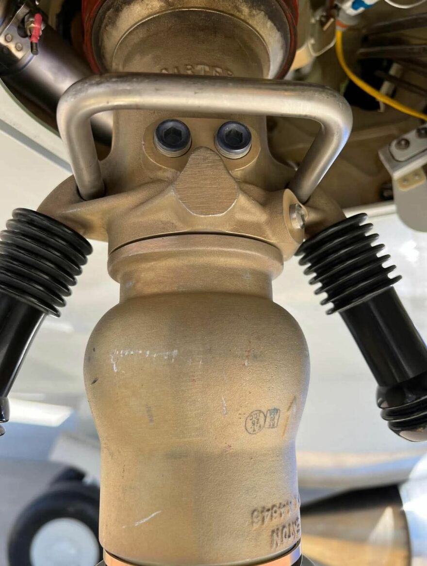 Close-up of a mechanical part resembling a face, illustrating pareidolia in everyday objects and machinery.