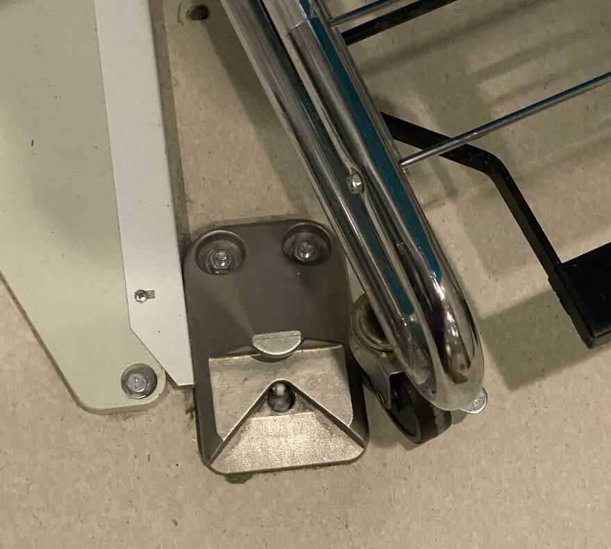 Metal hardware and a chrome rack creating a face-like image demonstrating pareidolia in everyday objects.