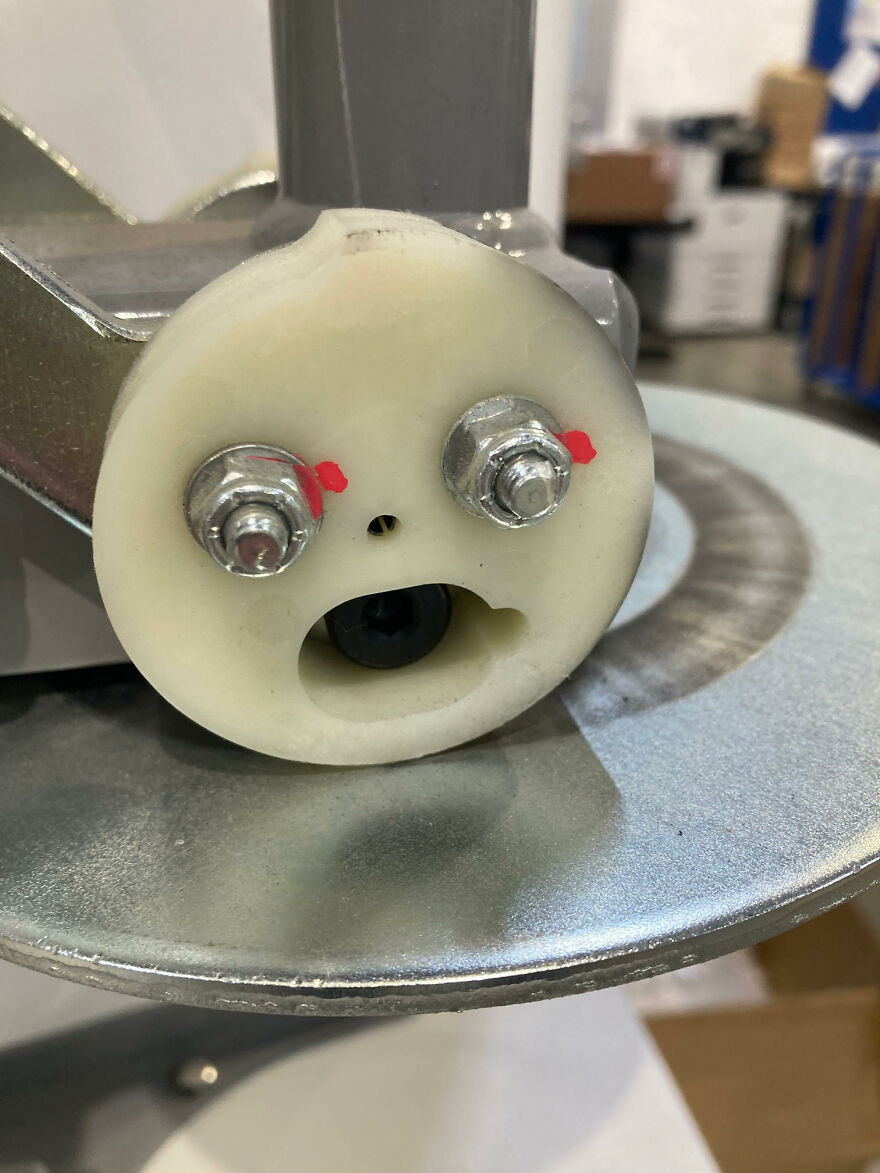 Close-up of machine part resembling a surprised face, an example of pareidolia captured in a photo.