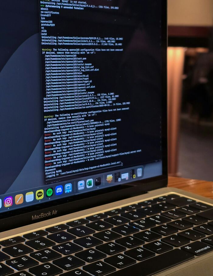 Close-up of MacBook Air screen showing code and terminal commands, illustrating intelligence in unexpected ways.