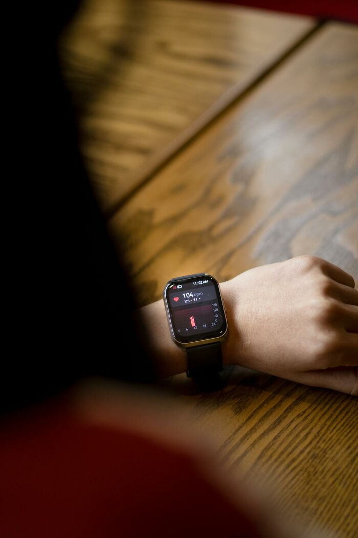 Person checking heart rate on a smartwatch, illustrating weird and interesting medical facts about health monitoring technology.