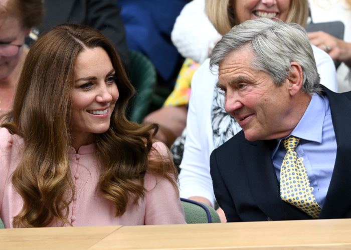 Duchess Kate Middleton smiles at a man, a remarkable family comparison to Prince Louis' 8th birthday portrait.