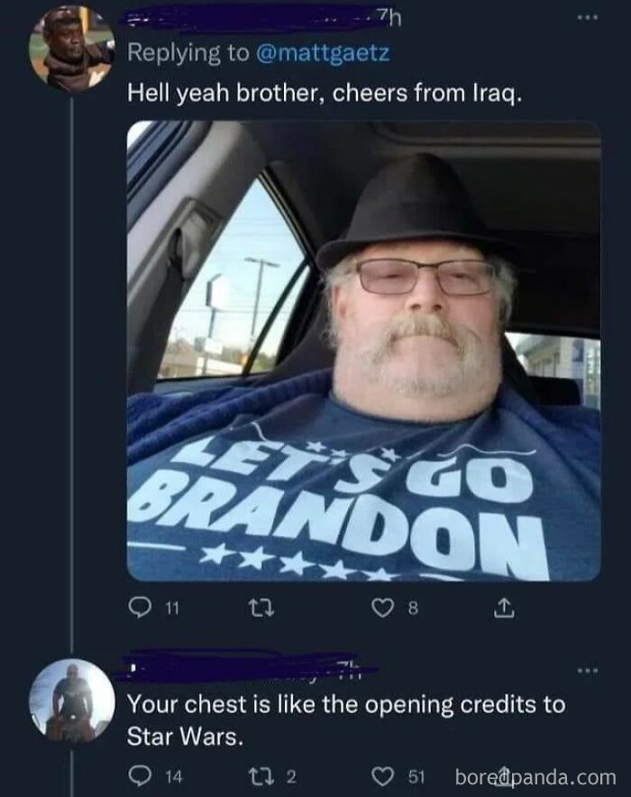 A man in a hat and glasses, wearing a Let's Go Brandon shirt, receiving a rare burn about his chest.