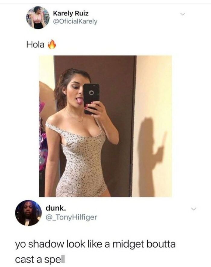 A girl takes a selfie, sticking out her tongue. Her shadow behind her casts a unique shape, a rare burn.