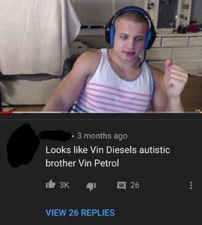 A man in a tank top and headphones, reacting to a savage burn in a YouTube comment section. Rare burns at their finest.