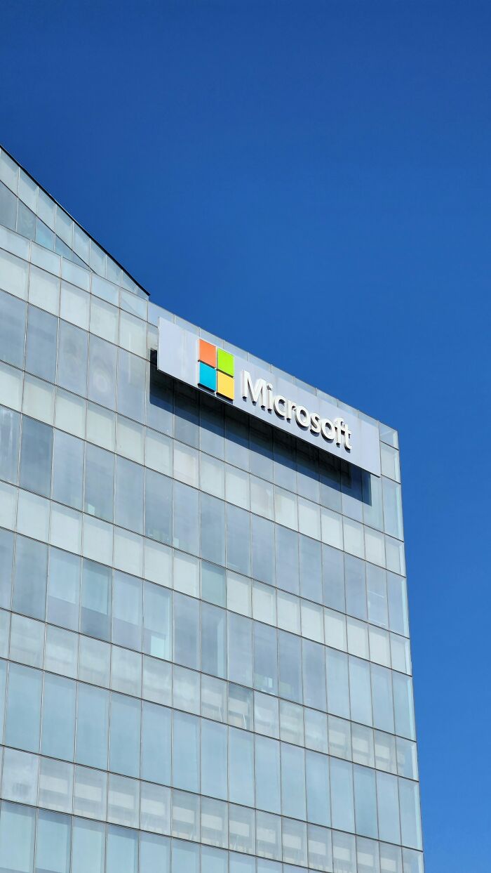 Microsoft corporate building exterior under clear blue sky, example of companies' social media posts mistakes.