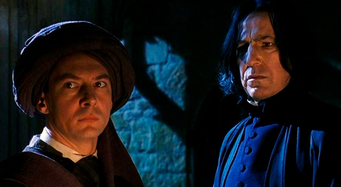Two actors in dark, wizard costumes in a dimly lit scene referencing Black Snape and Harry Potter reboot casting.