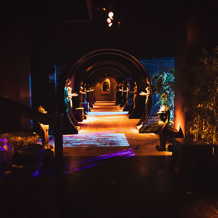 Dimly lit club interior with arches and statues, reflecting what a former club manager saw that night after misconduct accusations. Dimly lit club interior with arches and statues, reflecting what a former club manager saw that night after misconduct accusations.