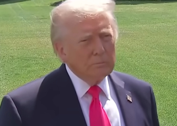 Former U.S. president standing outdoors in suit and red tie, symbolizing concern over missing or deceased scientists.